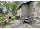 Outdoor patio area with stone fireplace, dining set, and statue, perfect for entertaining at 5117 N Park Ave, Indianapolis, IN 46205