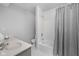 Functional bathroom with a combined tub and shower with gray accents at 5353 Chipwood Ln, Indianapolis, IN 46226