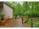 Relaxing outdoor deck space with views of the lush, green backyard at 5353 Chipwood Ln, Indianapolis, IN 46226