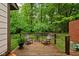 Cozy outdoor deck with comfortable seating and lush wooded views at 5353 Chipwood Ln, Indianapolis, IN 46226