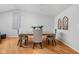 Well-lit dining room featuring a wooden table with upholstered chairs and modern decor at 5353 Chipwood Ln, Indianapolis, IN 46226