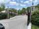 Elegant gated entrance to a private estate with lush landscaping at 5353 Chipwood Ln, Indianapolis, IN 46226