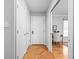 Hallway with hardwood flooring and direct access to a bedroom/office space at 5353 Chipwood Ln, Indianapolis, IN 46226