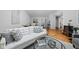 Bright living room featuring a comfortable white sofa, stylish decor, and hardwood flooring at 5353 Chipwood Ln, Indianapolis, IN 46226