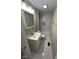 This newly renovated bathroom showcases marble tile, modern fixtures, and an updated vanity at 5735 Liberty Creek E Dr, Indianapolis, IN 46254
