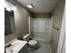 Bathroom with white tiled floors, a tub and shower combo, and vanity with sink at 5735 Liberty Creek E Dr, Indianapolis, IN 46254