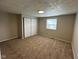 This bedroom offers neutral walls, carpeted flooring and a double door closet at 5735 Liberty Creek E Dr, Indianapolis, IN 46254