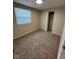 Bedroom with neutral walls, carpeted floor, and window for natural light at 5735 Liberty Creek E Dr, Indianapolis, IN 46254