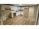 Well-lit kitchen with white cabinets and modern flooring, offering a clean and stylish design at 5735 Liberty Creek E Dr, Indianapolis, IN 46254