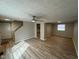 Bright living room featuring updated floors and ample space, perfect for Gathering gatherings at 5735 Liberty Creek E Dr, Indianapolis, IN 46254