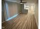 Bright living room featuring updated floors and ample space, open to a modern kitchen at 5735 Liberty Creek E Dr, Indianapolis, IN 46254