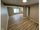 Inviting living area showcasing neutral walls and updated floors for modern comfort at 5735 Liberty Creek E Dr, Indianapolis, IN 46254