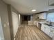 Open-concept living space featuring a modern kitchen with an open view to the living area at 5735 Liberty Creek E Dr, Indianapolis, IN 46254