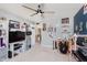 Unique bedroom with ceiling fan, blue and gray walls, and eclectic decorations, for hobbies and interests at 5913 Monticello Square Ln, Indianapolis, IN 46234