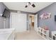 Cozy bedroom with gray walls, closet, and a TV, offering a comfortable retreat at 5913 Monticello Square Ln, Indianapolis, IN 46234