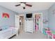 This bedroom features light blue walls, white furniture and a closet space to provide a tranquil atmosphere at 5913 Monticello Square Ln, Indianapolis, IN 46234