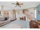 Comfortable living room with a large sectional couch, hardwood floors, and an open staircase at 5913 Monticello Square Ln, Indianapolis, IN 46234