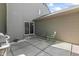 Back patio area with chairs and a grill at 601 Conner Creek Dr, Fishers, IN 46038