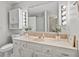 Bright bathroom features a vanity with a large mirror, Hollywood style vanity lighting, and marble tile floor at 601 Conner Creek Dr, Fishers, IN 46038