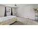 A clean bedroom with a ceiling fan and a window with natural light at 601 Conner Creek Dr, Fishers, IN 46038