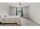 A clean bedroom with a ceiling fan and a window with natural light at 601 Conner Creek Dr, Fishers, IN 46038