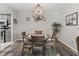 Charming dining area featuring a stylish light fixture and neutral decor that is perfect for entertaining or Gathering dinners at 601 Conner Creek Dr, Fishers, IN 46038