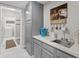 The kitchen area offers a wet bar area and a passthrough to the laundry room with a coffee bar at 601 Conner Creek Dr, Fishers, IN 46038