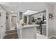 Bright kitchen featuring modern appliances, a breakfast bar, and ample counter space at 601 Conner Creek Dr, Fishers, IN 46038