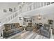 Open living space with a lofted area, dining area, and stairs providing access to the upstairs at 601 Conner Creek Dr, Fishers, IN 46038