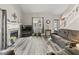 Comfortable living room featuring a fireplace, wood flooring, and stylish decor at 601 Conner Creek Dr, Fishers, IN 46038