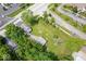 Aerial view of home with garage on a spacious lot with mature trees and landscaping at 606 E County Line Rd, Indianapolis, IN 46227