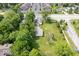 Aerial view of property showcasing the home, garage, large lot, and landscaping at 606 E County Line Rd, Indianapolis, IN 46227