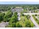 Aerial view of property showcasing home, garage, large lot, and community at 606 E County Line Rd, Indianapolis, IN 46227