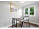 Bright dining area with a window view and a table set for two at 606 E County Line Rd, Indianapolis, IN 46227