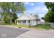 Charming single-story home featuring a cozy front porch and well-manicured lawn at 606 E County Line Rd, Indianapolis, IN 46227