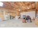 Spacious unfinished garage interior for parking and ample storage solutions at 606 E County Line Rd, Indianapolis, IN 46227