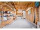 Unfinished garage interior with shelving for storage solutions and natural light at 606 E County Line Rd, Indianapolis, IN 46227