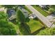 A charming home featuring a wooden deck, a lush lawn, and a fenced backyard at 6102 Primrose Ave, Indianapolis, IN 46220