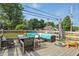 Back deck includes outdoor seating, a dining area, and an umbrella at 6102 Primrose Ave, Indianapolis, IN 46220