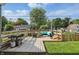 Back deck is furnished with a table and grill for outdoor entertaining at 6102 Primrose Ave, Indianapolis, IN 46220