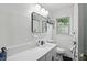 Modern bathroom featuring a sleek vanity, stylish fixtures, and a tiled shower area at 6102 Primrose Ave, Indianapolis, IN 46220