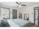 Bright bedroom with a king bed and a view from the bed at 6102 Primrose Ave, Indianapolis, IN 46220