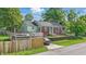 Charming home features a backyard with privacy fence and outdoor dining space at 6102 Primrose Ave, Indianapolis, IN 46220