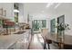 Bright kitchen with stainless steel appliances, white cabinets, and a kitchen island at 6102 Primrose Ave, Indianapolis, IN 46220