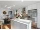 Spacious kitchen featuring stainless steel appliances, a center island, and an adjacent breakfast nook at 6102 Primrose Ave, Indianapolis, IN 46220