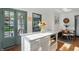 Bright kitchen island with white countertop and gold hardware, perfect for casual dining and meal prep at 6102 Primrose Ave, Indianapolis, IN 46220