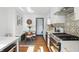 Well-appointed kitchen with a breakfast nook, white cabinetry, and stainless steel appliances at 6102 Primrose Ave, Indianapolis, IN 46220