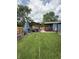 Well-maintained backyard with covered patio, grilling area, and green lawn at 6126 Regina Cir, Indianapolis, IN 46224