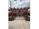 Charming backyard featuring a pergola, deck, and black metal fencing at 6126 Regina Cir, Indianapolis, IN 46224