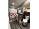 Unique bathroom featuring slate tile, white vanity and shower with floral curtain at 6126 Regina Cir, Indianapolis, IN 46224